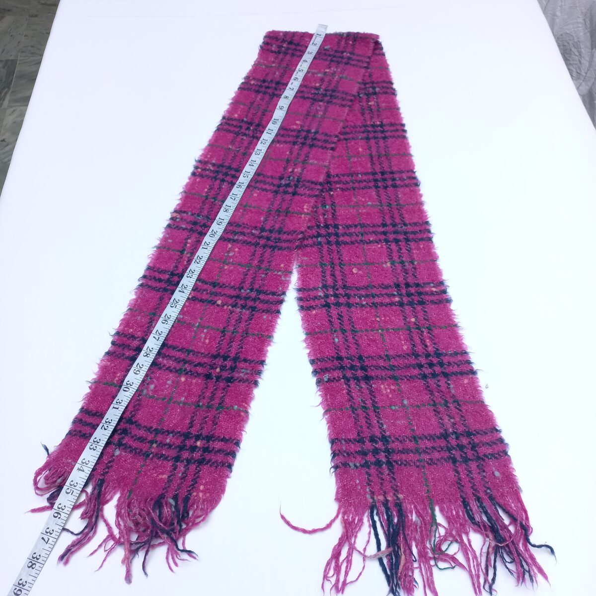 Preloved Burberry pink tartan wool scarf featuring iconic check pattern and fringed edges. Stylish winter fashion accessory ideal for men and women. Available now at abbottbrands via lajimart.com – your trusted source for designer used items.