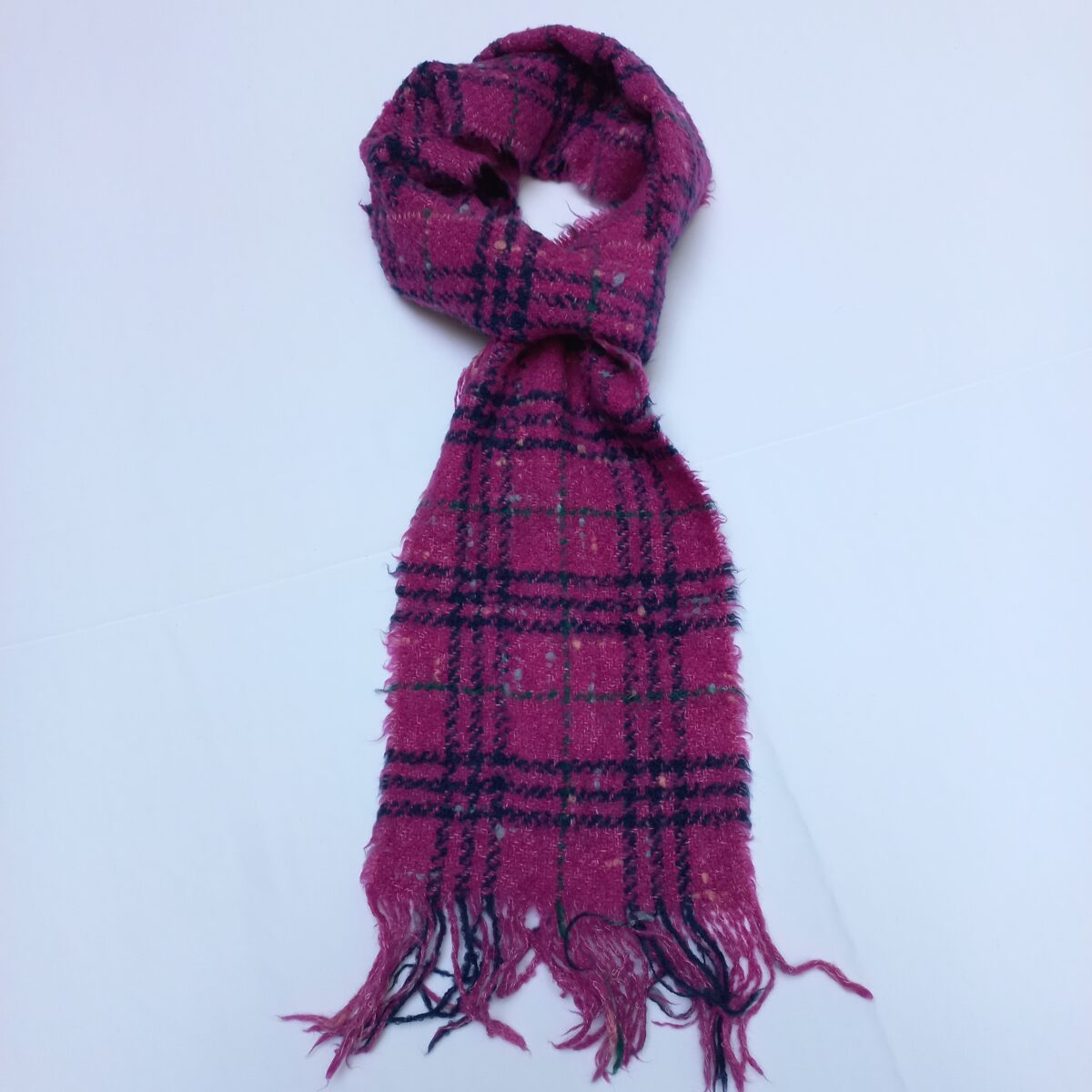 Authentic Burberry pink checkered scarf in soft wool, shown neatly folded with fringes. Luxury fashion at affordable price from abbottbrands on lajimart.com. Ideal for gifting and cold-weather styling.