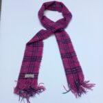Authentic Burberry pink checkered scarf in soft wool, shown neatly folded with fringes. Luxury fashion at affordable price from abbottbrands on lajimart.com. Ideal for gifting and cold-weather styling.